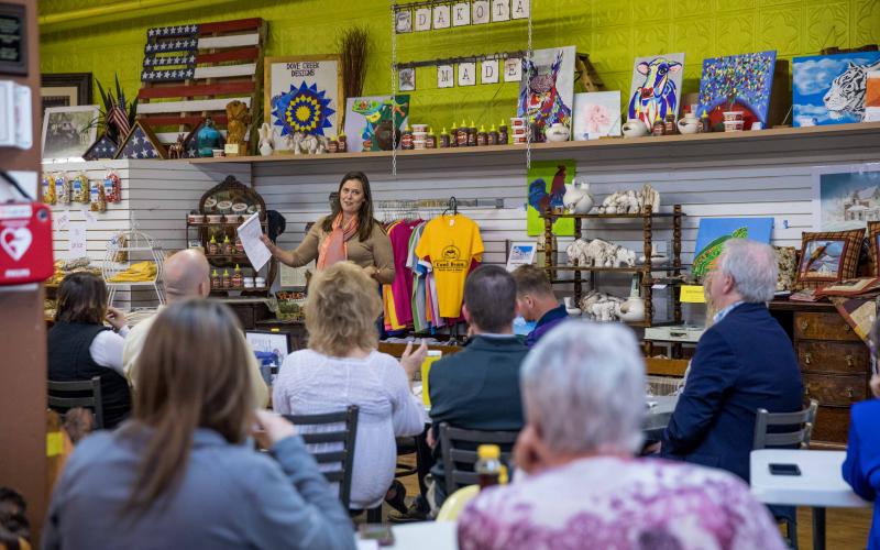 small business owner talking to a group of people