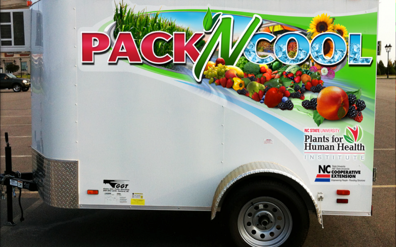 A medium-sized cooler trailer with "Pack N Cool" lettering on the side