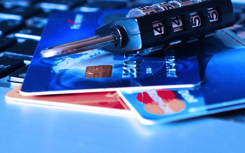 an image with credit cards and a combination lock