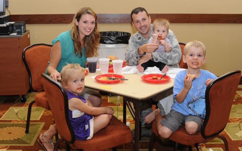 A family enjoying dinner together.