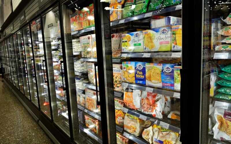 Frozen vegetable aisle at a grocery store.