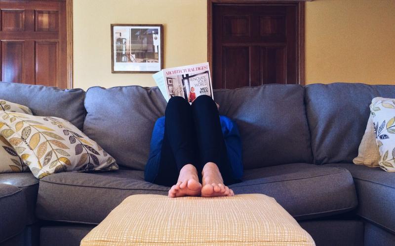 Young woman sitting on a couch.