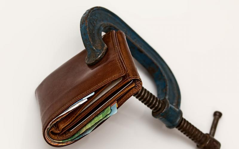 A wallet inside a tight clamp.