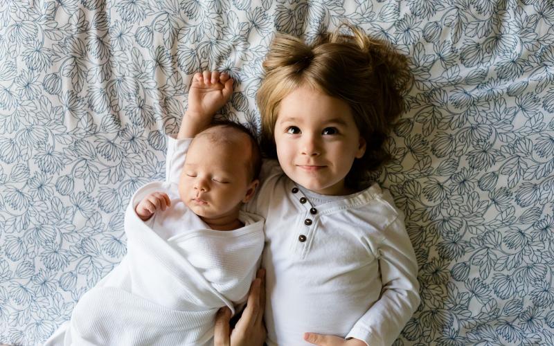 two children resting in bed