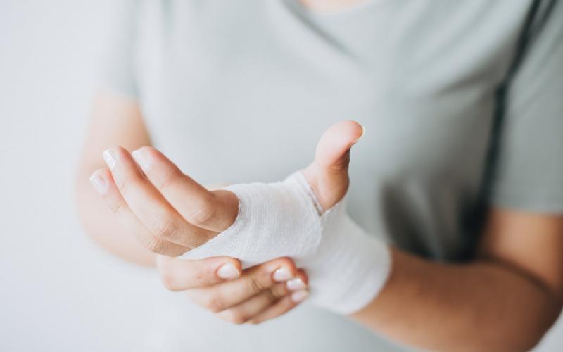 Hand wrapped in a bandage.