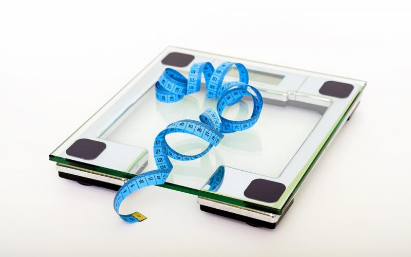 body measuring tape on a digital scale