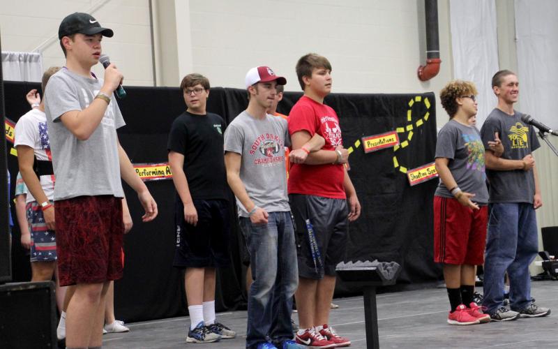 group of male 4-H youth performing a sketch