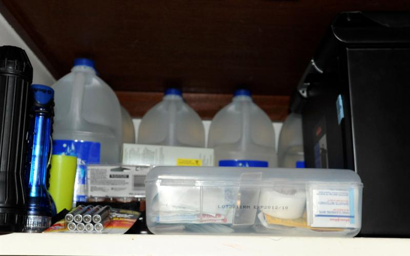 collection of emergency food and supplies in a raised cabinet