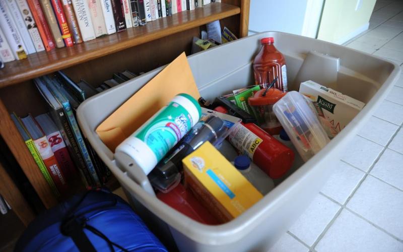 A family emergency kit in a gray plastic tote. Photo by Zachary Kittrie