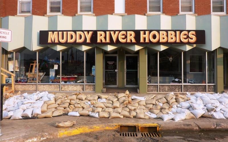 Small business &quot;Muddy River Hobbies&quot; with sandbags in front of entrance. Photo by Jeannie Mooney, FEMA.