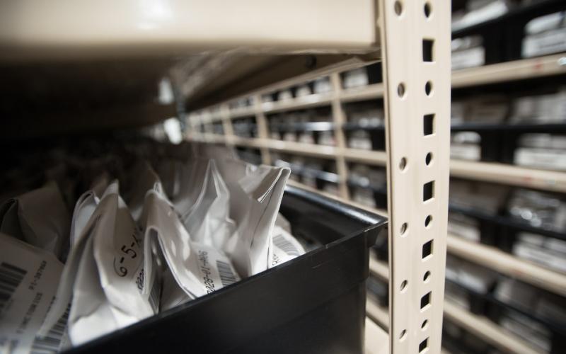 plant seeds in moisture-proof foil bags stored in bins on a shelf