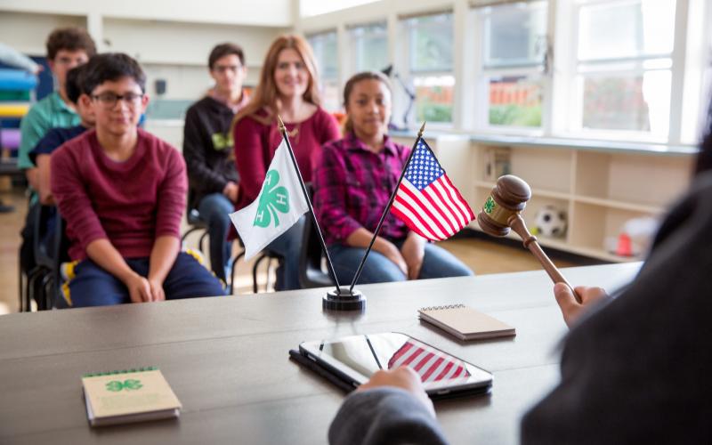 4-H meeting 4-H members sitting in a meeting