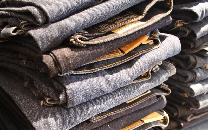 an image of several stacks of blue jeans