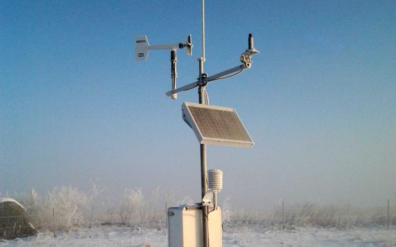 A South Dakota Mesonet station in a snow-covered field.