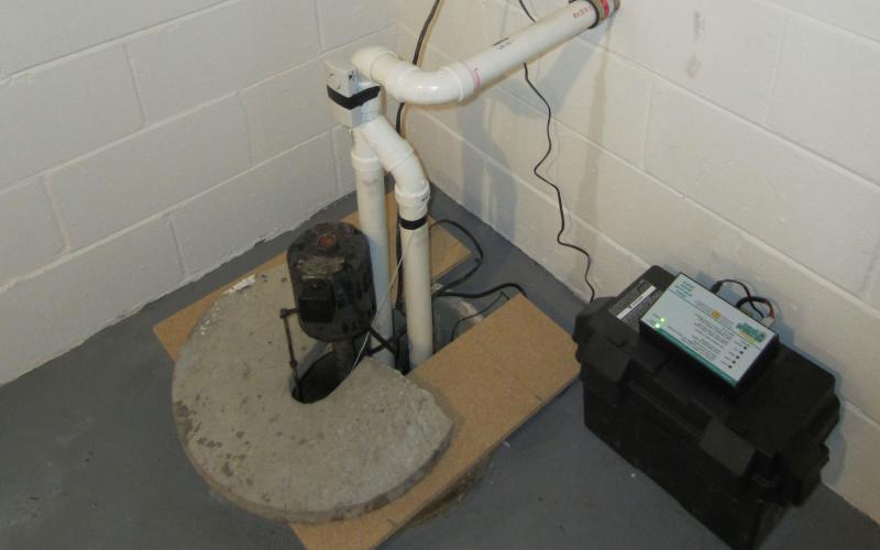 A sump pump and emergency backup battery set up in a basement. Courtesy: Jeff Covey (CC BY-SA 2.0)