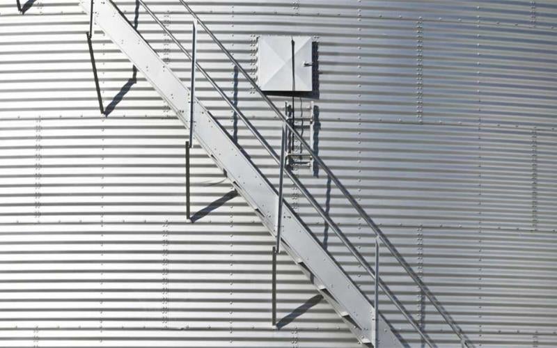 Modern grain bin exterior with built-in staircase.
