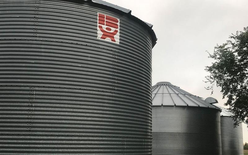 Three grain storage bins.
