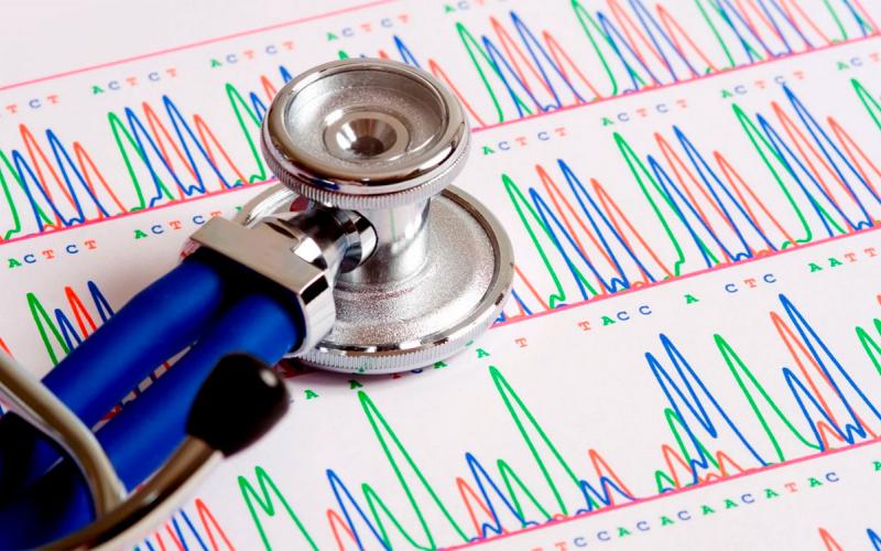 Stethoscope atop a gentic sequencing report.