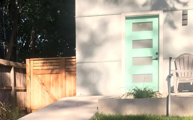 A a gently sloping ramp walkway leading to a home with a no-step entrance.