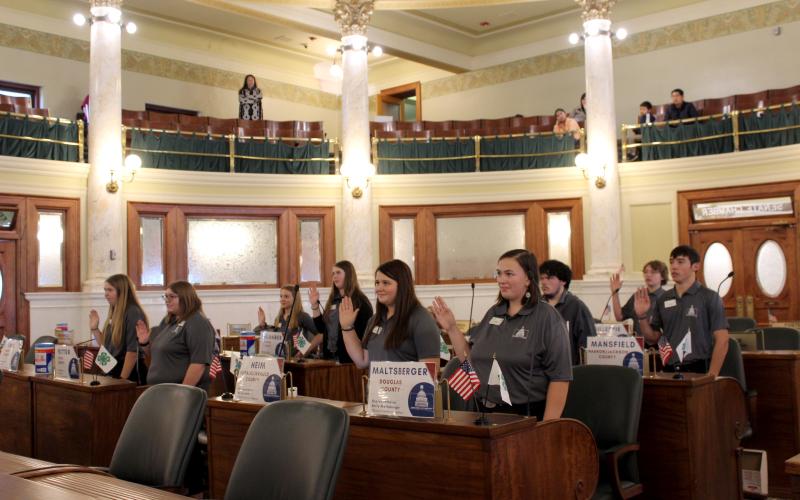 Group of 4-H youth being sworn in in the state legislative chamber in Pierre South Dakota