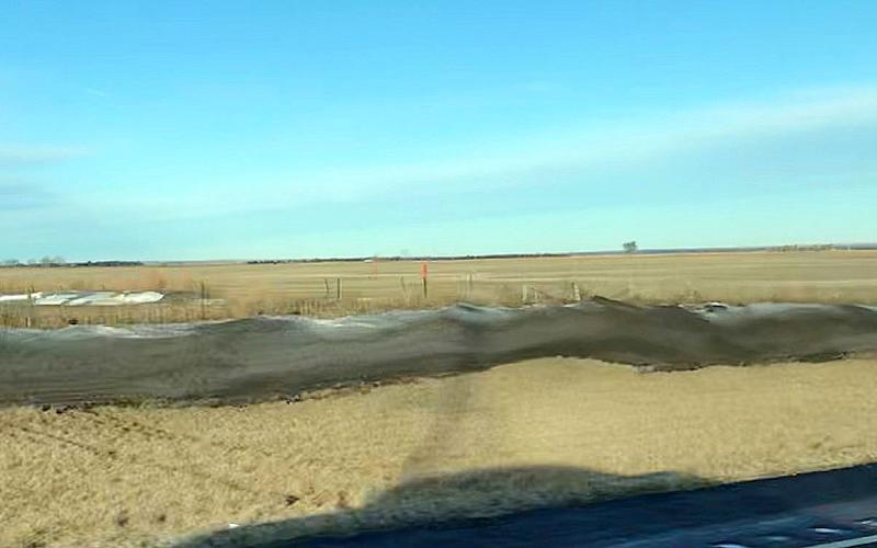 black-colored snow in a ditch