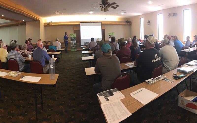 Group of farmers and ranchers attending a drought meeting.