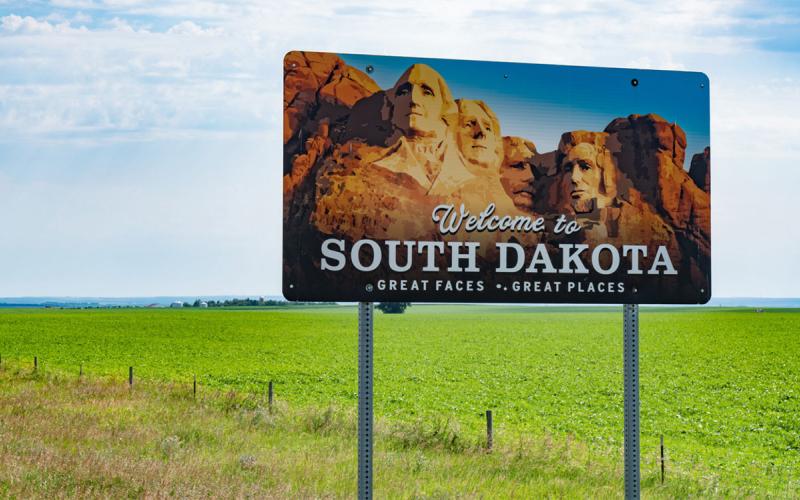 Road sign reading "Welcome to South Dakota - Great Faces, Great Places"
