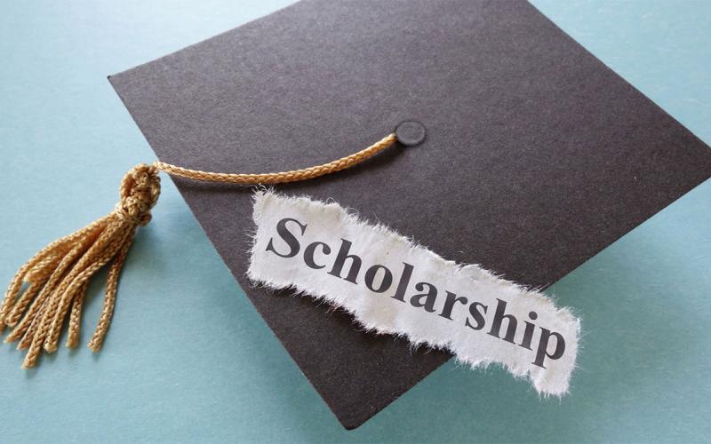Graduation cap and tassel. Text reading “Scholarship.”