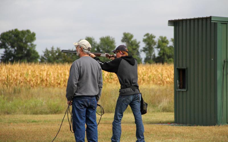 4-H Volunteer helping 4-H youth shooting trap