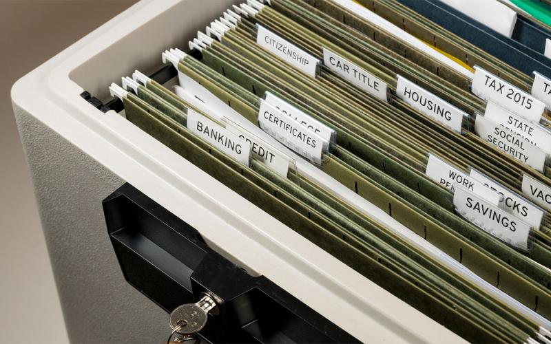 Fireproof file safe with important documents inside.