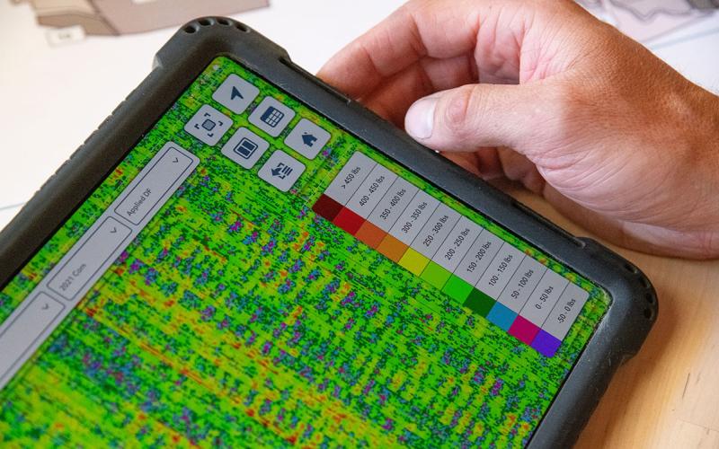 Tablet computer displaying precision planting data.