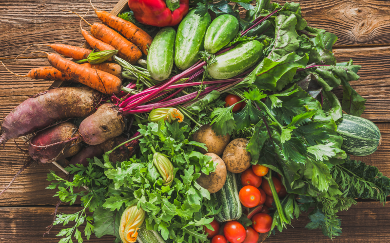 Group of fresh vegetables on wooden table
