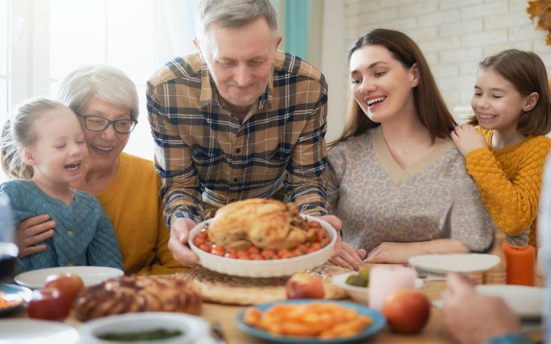 Family sharing a Thanksgiving meal.