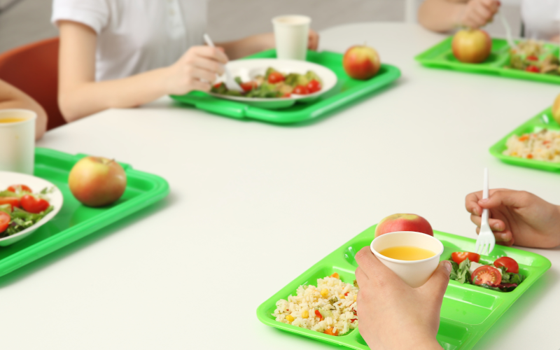 Group of students eating lunch at school