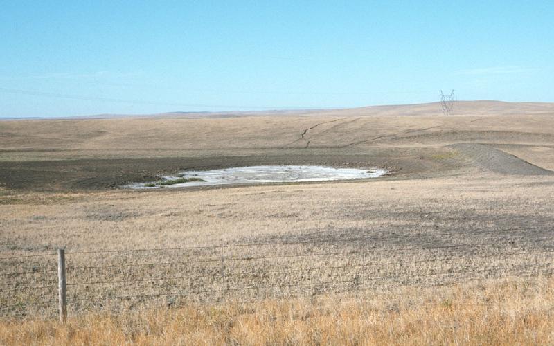 Dry, winter rangeland with minimal snow cover.