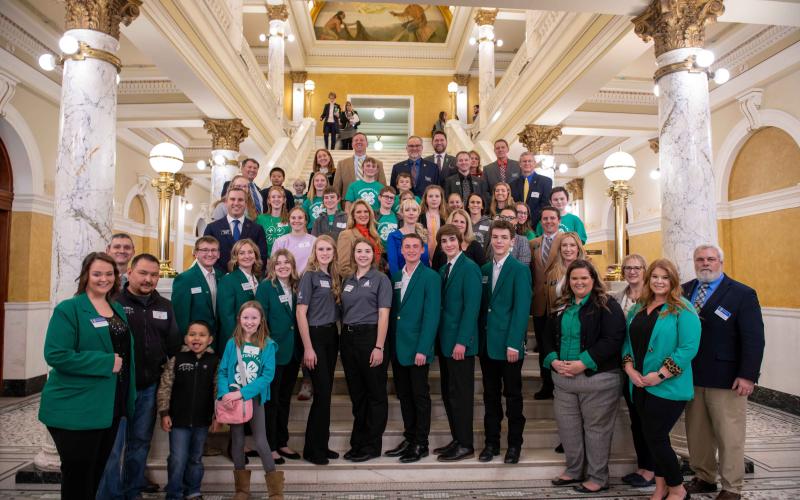 People pose on a staircase inside the South Dakota Capitol Building in Pierre for 4-H Capitol Day