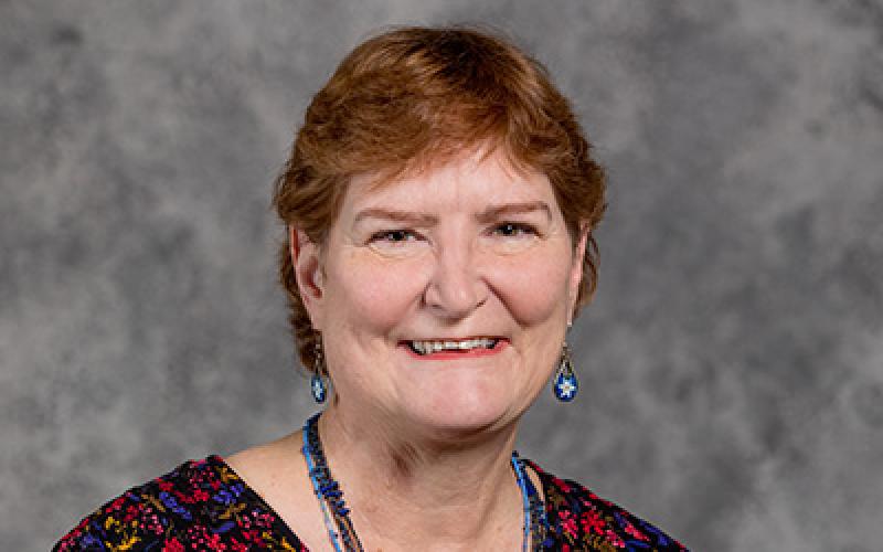 Professional headshot of Rhoda Burrows