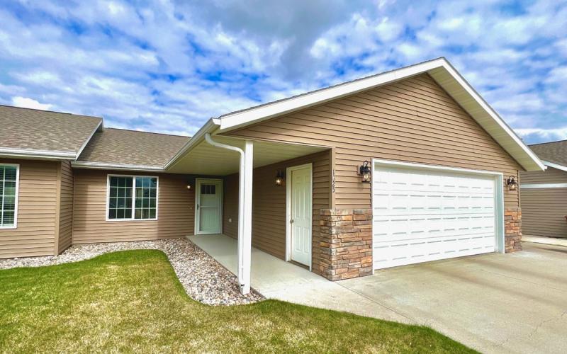 Accessible home exterior with zero-entry doorway.