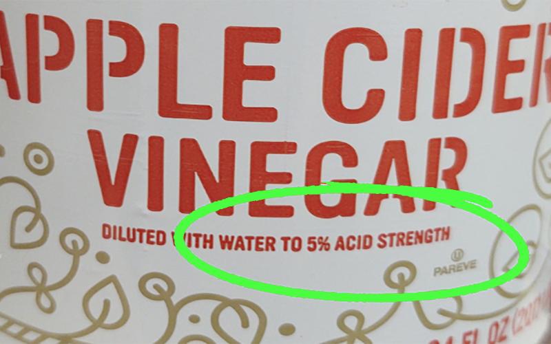 Apple cider vinegar label with 5% acidity text circled in green.