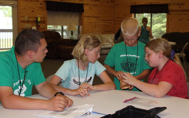 Youth campers working on a project together