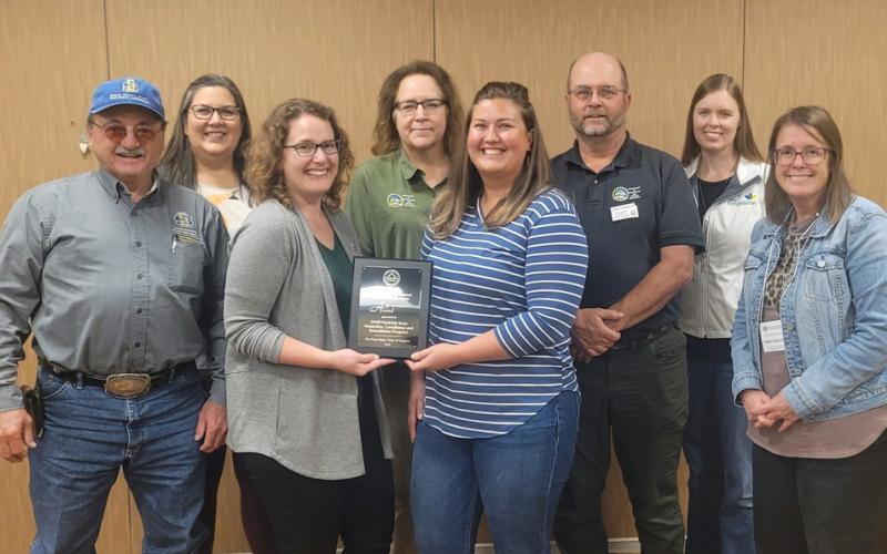 The South Dakota Association of Agricultural Extension Professionals present the Friend of the SDAAEP Award to the SD DANR Inspection, Compliance and Remediation employees