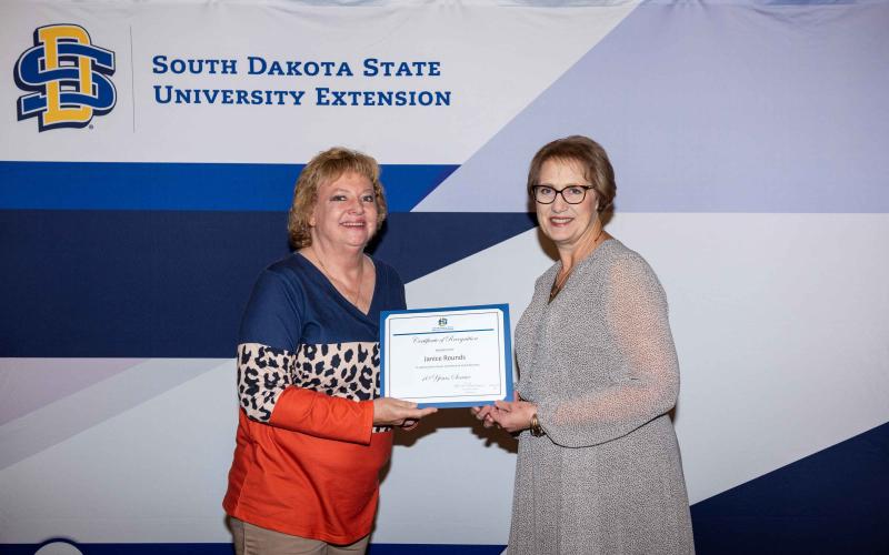 Janice Rounds receives her 10-year certificate from Karla Trautman