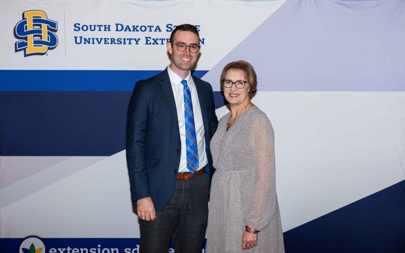 John McMaine smiles at the camera with Karla Trautman