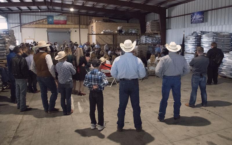Group of farmers and ranchers gathered at an emergency meeting.