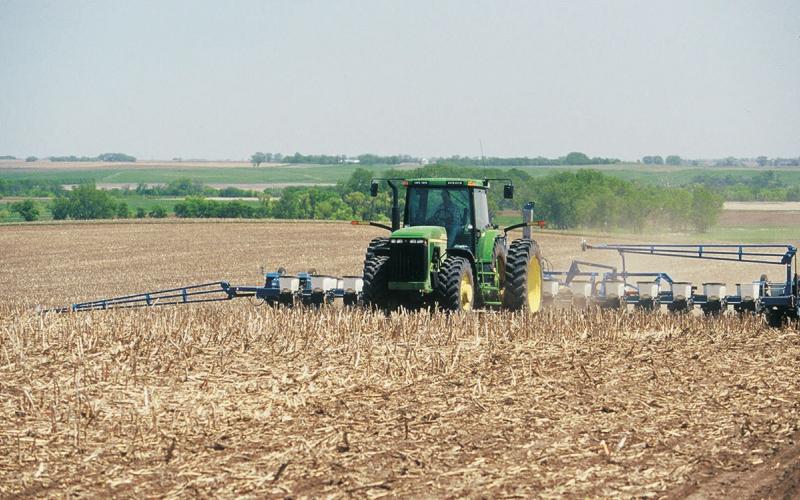 Tractor planting seed in a no-till field.