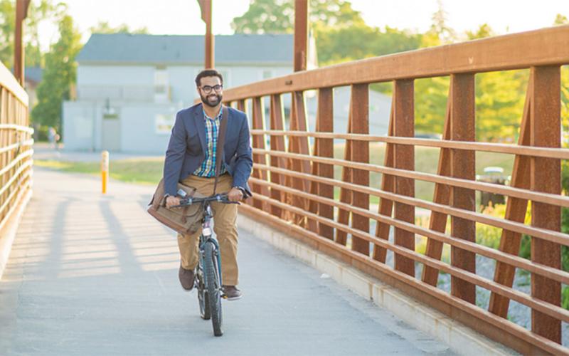Man riding a bicycle to work.