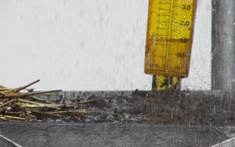 Rain falls on a sample of conventional tilled in a rainfall simulator.