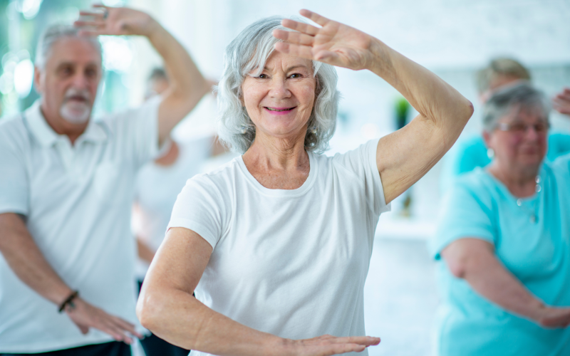 Group of older adults practicing tai chi