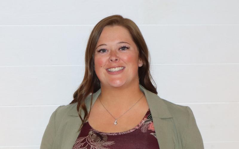Samantha Schlaffman holds up her plaque