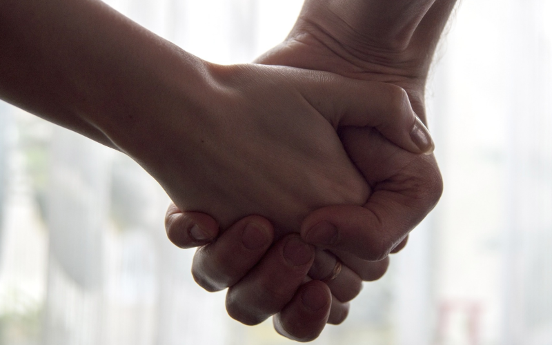 two people holding hands